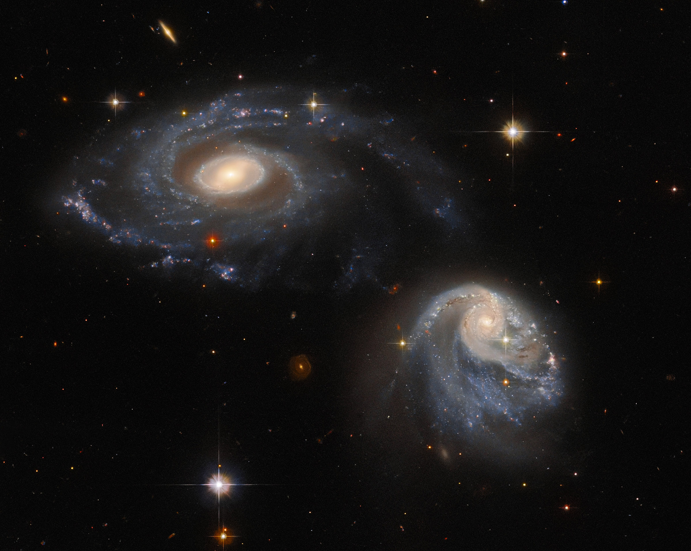 New Hubble Image Captures Two Galaxies Intersecting