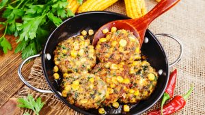 Corn pancakes with minced meat on the table