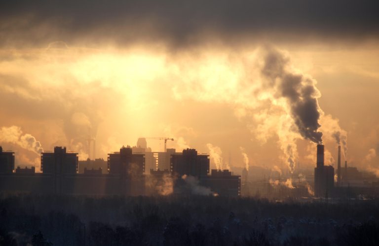 A factory seen in the distance.