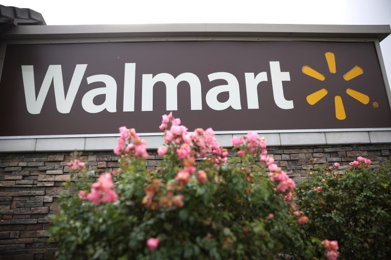 A sign is posted in front of a Walmart store on November 16, 2021 in American Canyon, California.