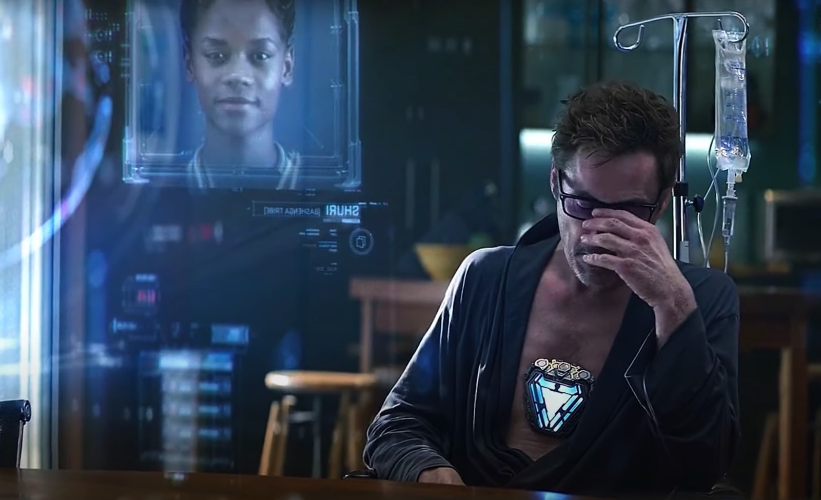 Shuri (Leticia Wright) on the hit list in Endgame with Tony Stark (Robert Downey Jr.) in the background.