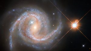 Hubble image of spiral galaxy and milky way stars