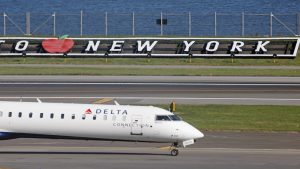 A Delta Airlines jet moves along the runway at Laguardia AIrport on November 10, 2022 in the Queens borough of New York City.