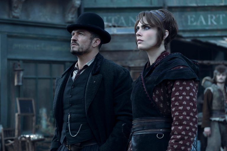Orlando Bloom (Rycroft Philostrate), Cara Delevingne (Vignette Stonemoss) in Carnival Row.
