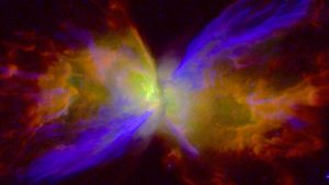 colorized image of butterfly nebula created from hubble observations