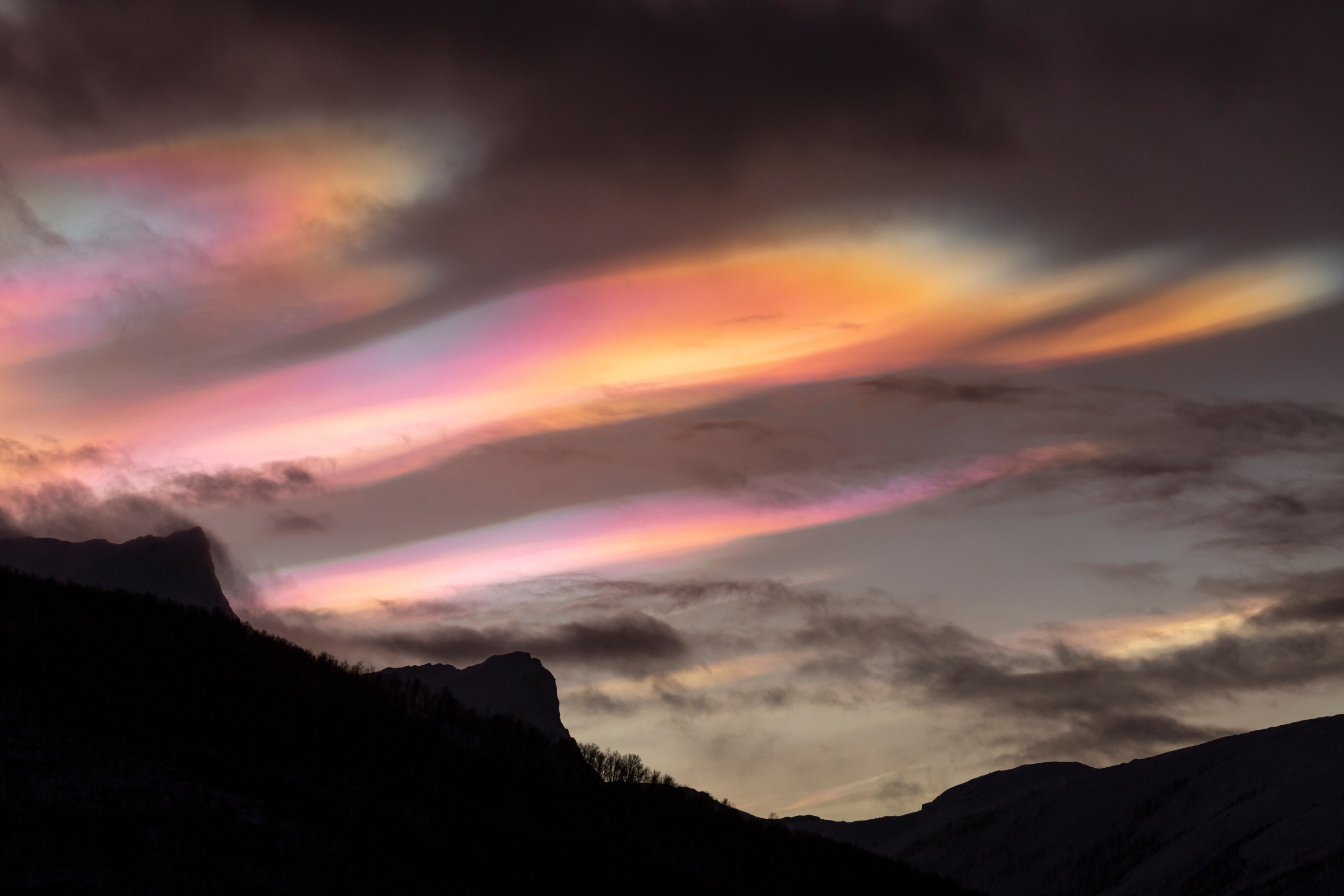 rainbow clouds over the mountains