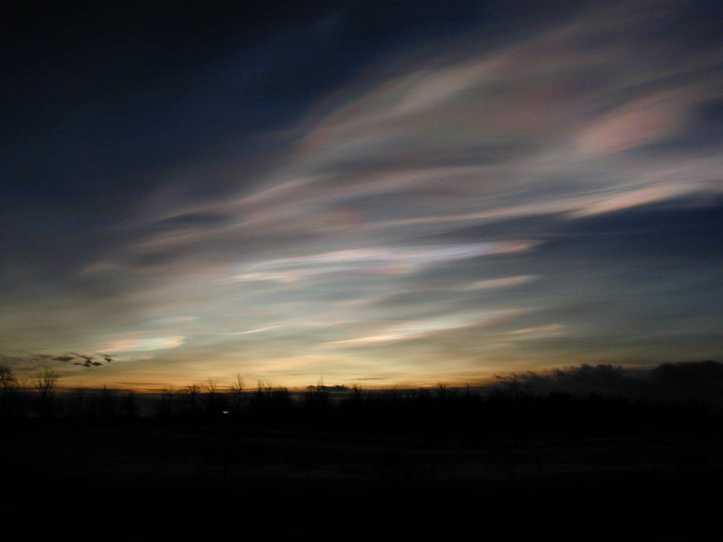 NASA image of rainbow clouds in sky