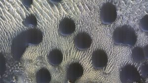 image of strange circular martian sand dunes