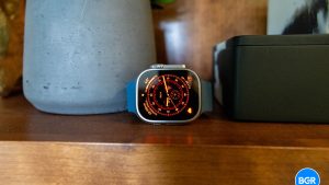 Apple Watch Ultra on a wood shelf