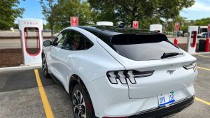 Ford EV charging at a Tesla Supercharger
