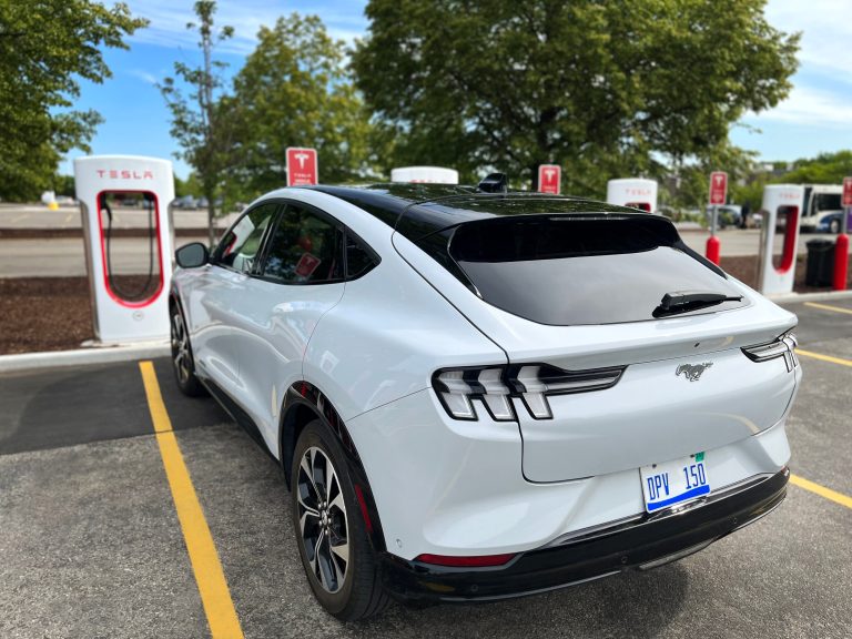 Ford EV charging at a Tesla Supercharger