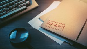 Private investigator desk with top secret envelopes, top secret file showing UFO whistleblower secrets