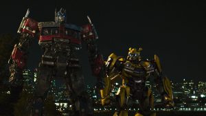 (L-R) Arcee, Optimus Prime and Bumblebee in Transformers: Rise of the Beasts.