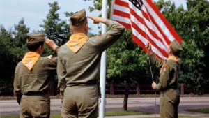 Boy Scouts saluting flag