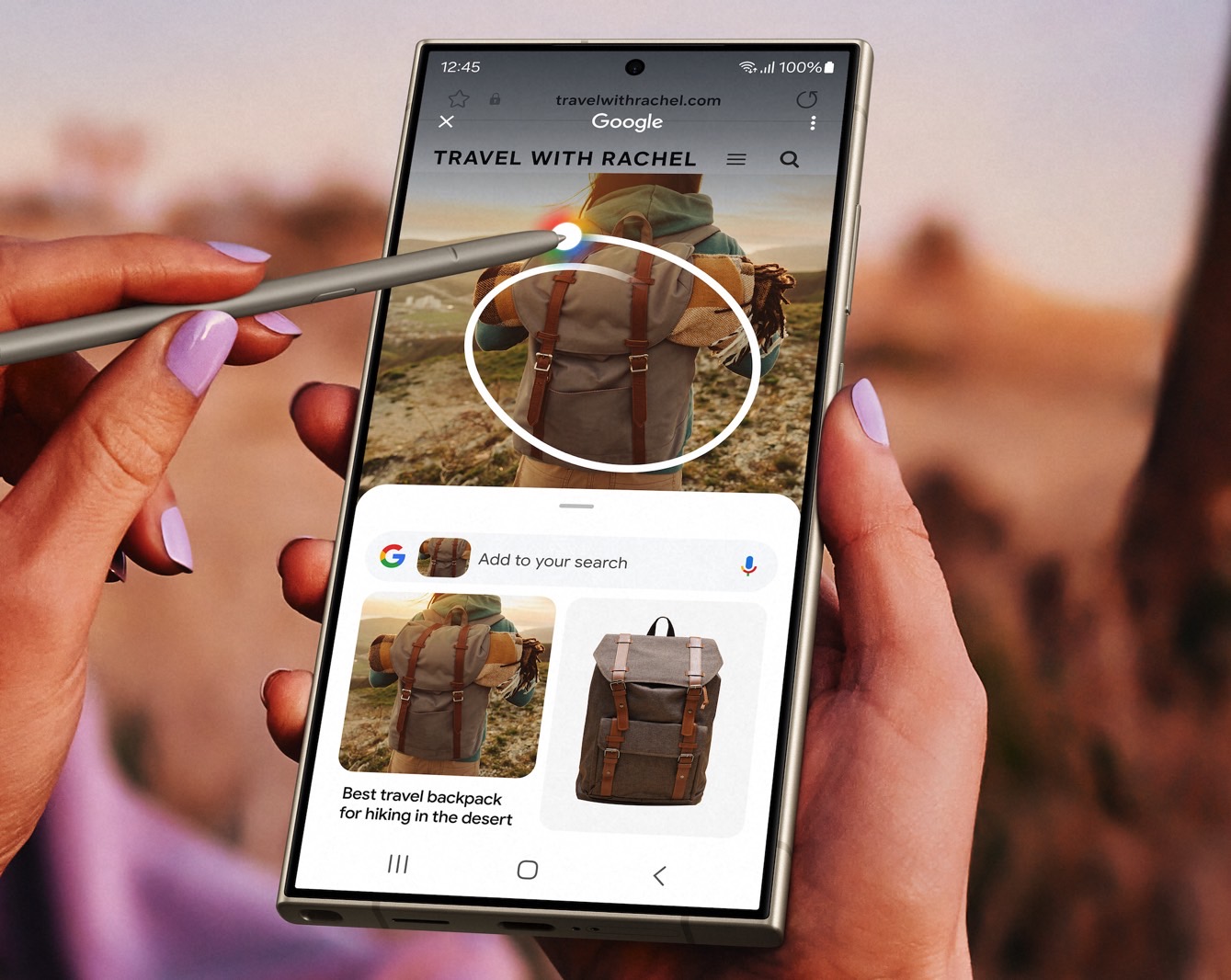  A hand holding an S Pen is hovering over the screen of a Samsung Galaxy smartphone which is displaying search results for 'best backpack for hiking in the desert'.