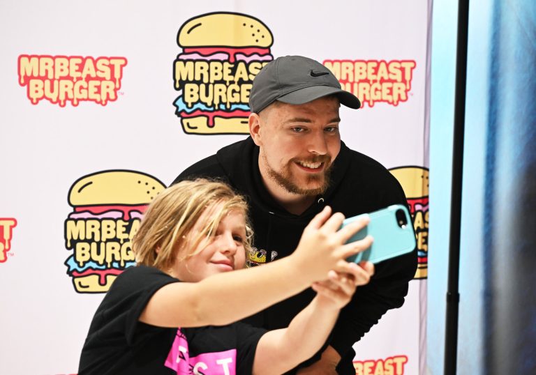 MrBeast poses with a fan