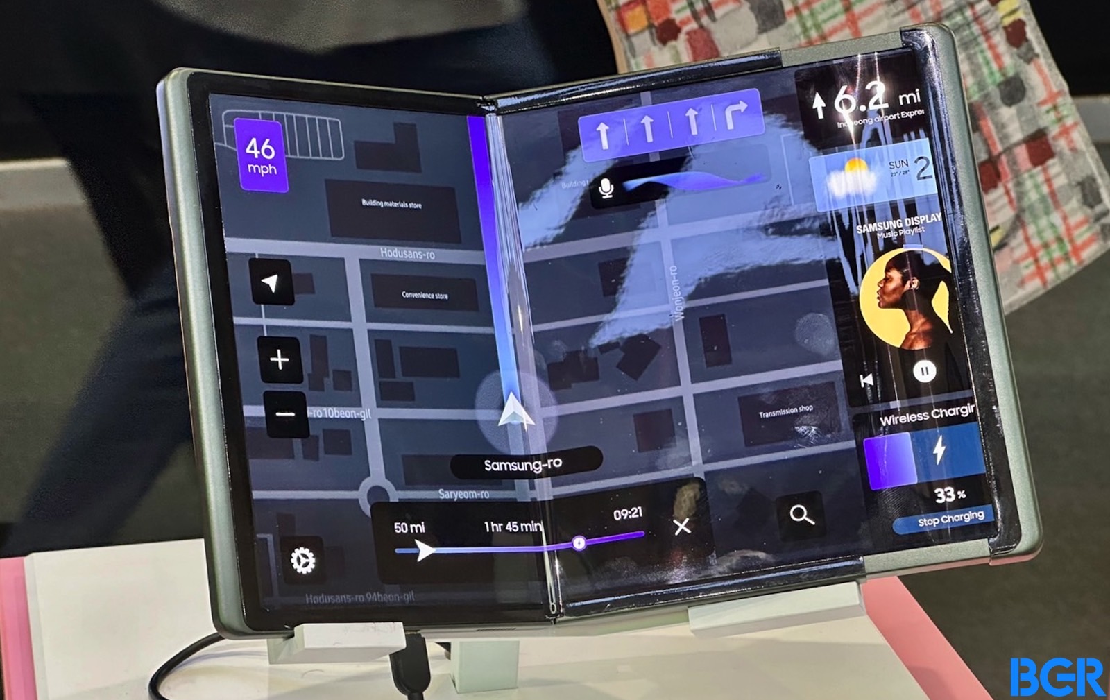 A navigation app running on a 12.4-inch device with a foldable and rollable OLED panel.