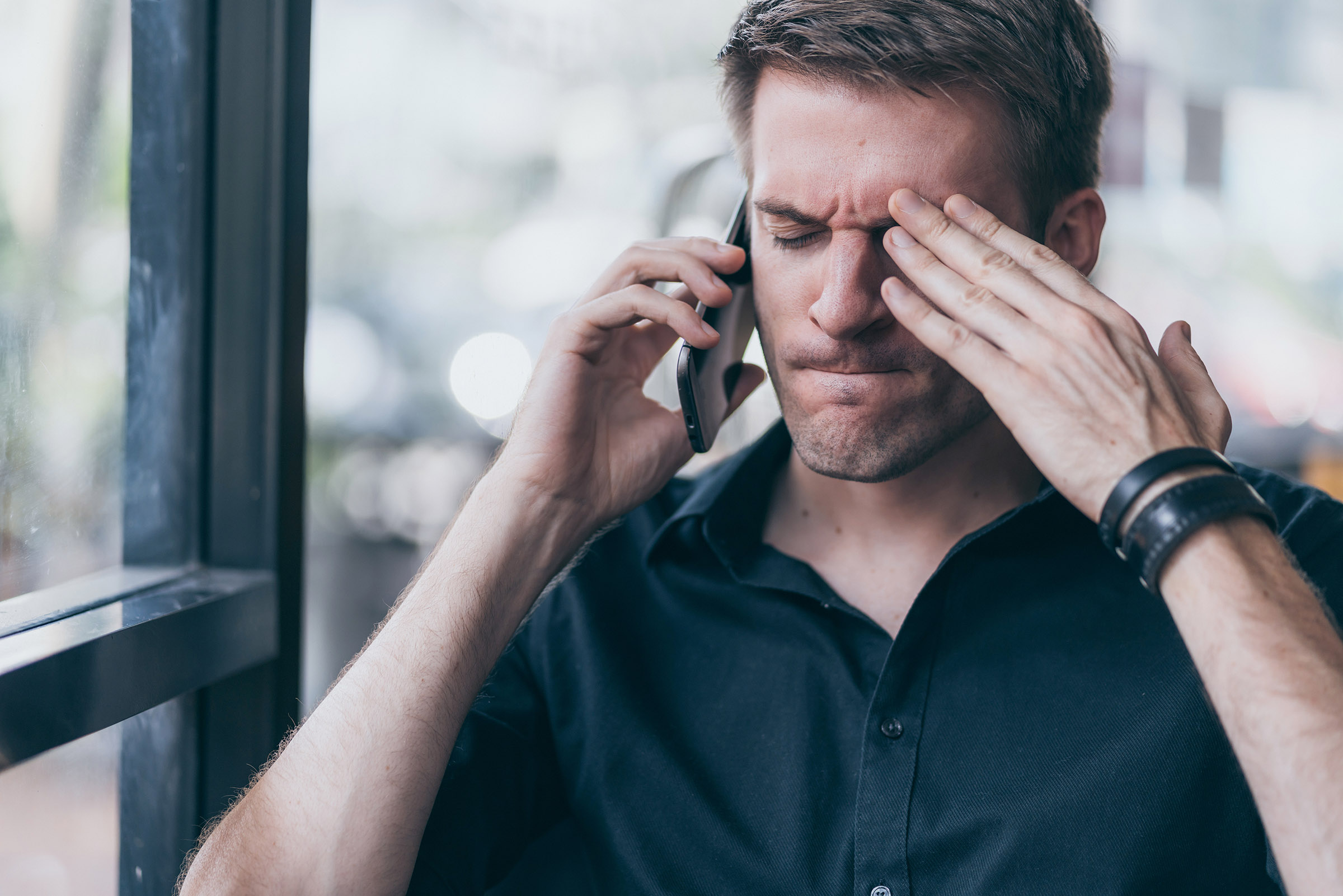 angry man on phone with customer service