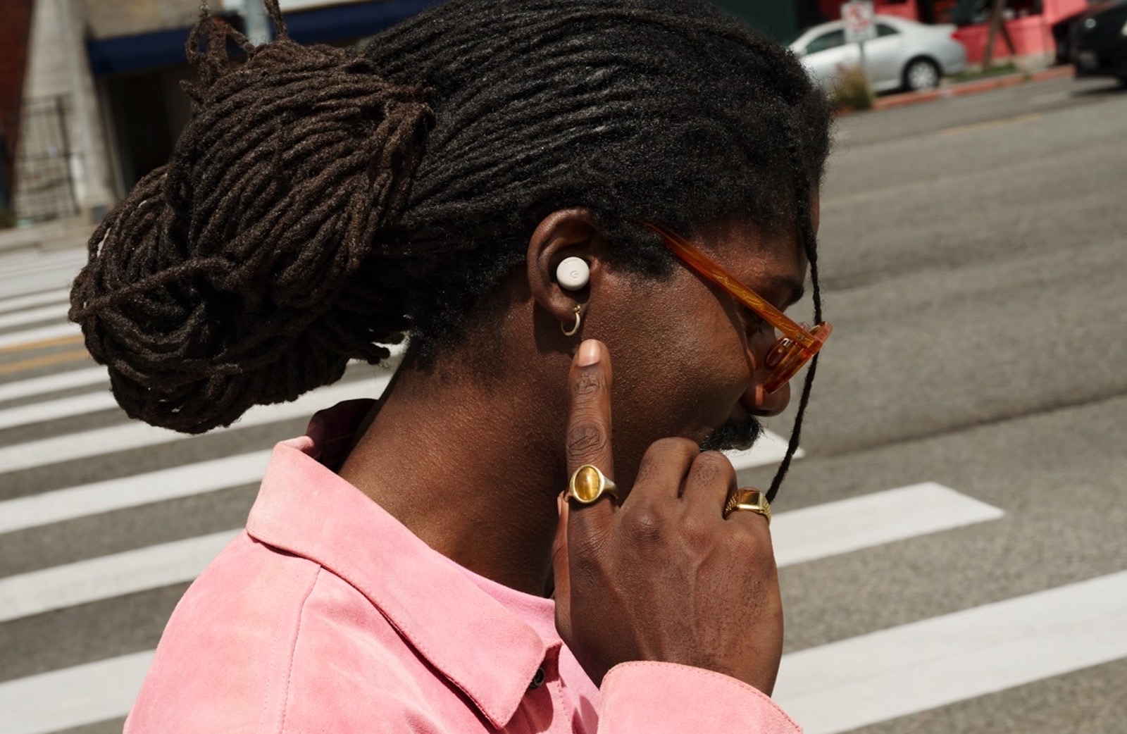 A person wearing Pixel Buds Pro 2 wireless earphones.