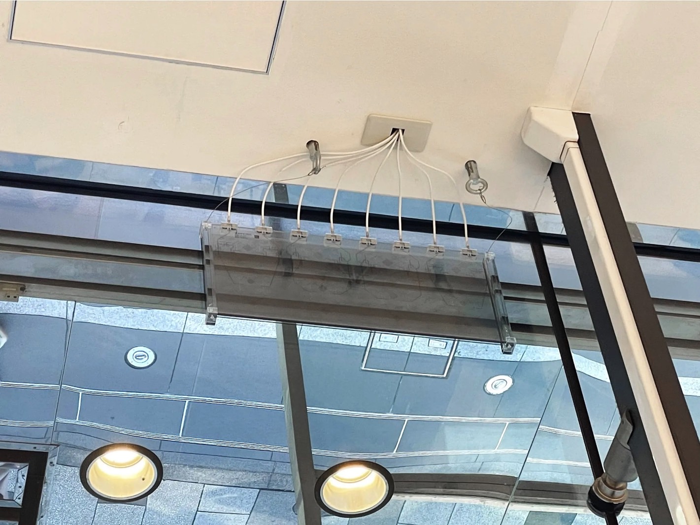 A 5G transparent base station attached to a window.