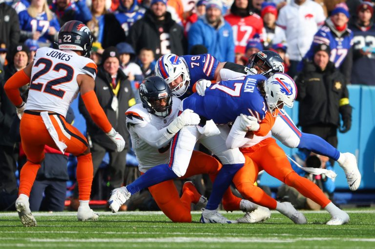 Josh Allen #17 of the Buffalo Bills carries the ball against the Denver Broncos.