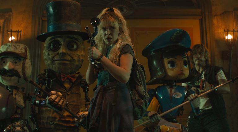 Herman (voiced by Anthony Mackie), PopFly (voiced by Brian Cox), Mr. Peanut (voiced by Woody Harrelson), Michelle (Millie Bobby Brown), Penny Pal (voiced by Jenny Slate) and Keats (Chris Pratt) in The Electric State.