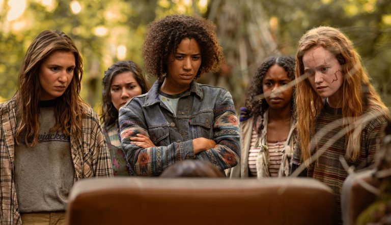 Sophie Nélisse as Teen Shauna, Vanessa Prasad as Teen Gen, Jasmin Savoy Brown as Teen Taissa, Silvana Estifanos as Teen Britt and Liv Hewson as Teen Van in Yellowjackets season 3.