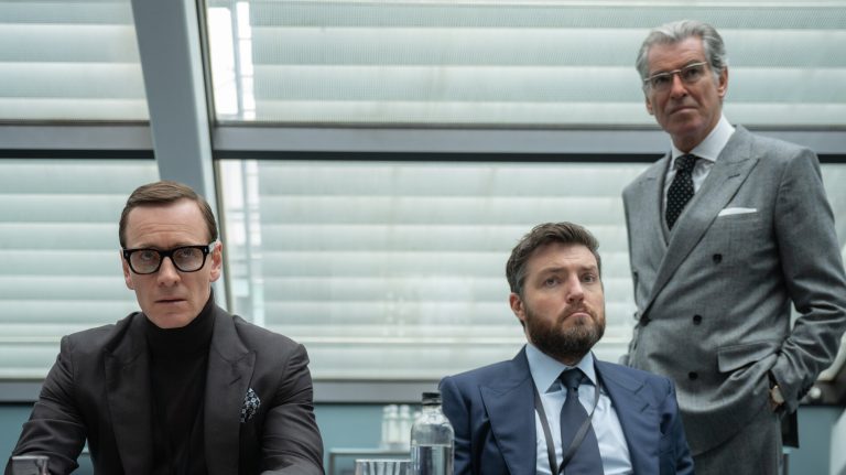 Michael Fassbender, Tom Burke, and Pierce Brosnan in Black Bag