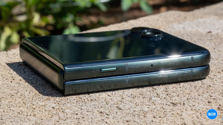 Side of the 2025 Motorola Razr folded on a wall.