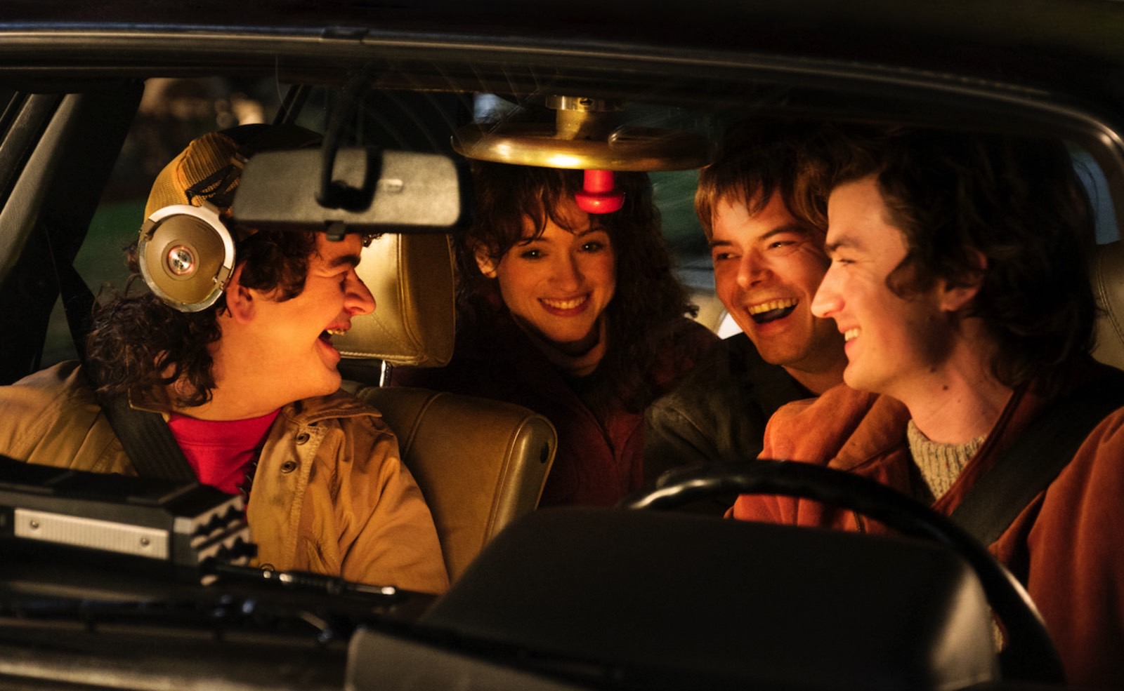 Dustin Henderson (Gaten Matarazzo), Nancy Wheeler (Natalia Dyer), Jonathan Byers (Charlie Heaton), and Steve Harrington (Joe Keery) in a Stranger Things season 5 BTS photo.
